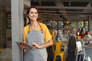 woman standing outside cafe